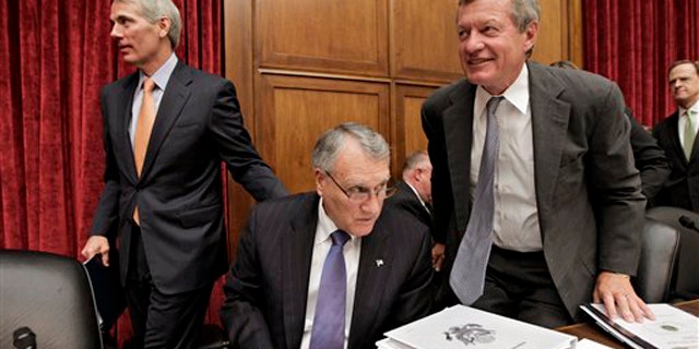 Sen. Jon Kyl, center, Sen. Max Baucus, right, and Sen. Rob Portman, left, finish with a meeting of the Joint Select Committee on Deficit Reduction on Capitol Hill in Washington Sept. 8.