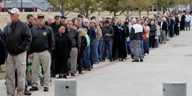 Feb. 11, 2013: People wait in line to attend a memorial service for Christopher Kyle at Cowboys Stadium in Arlington, Texas.