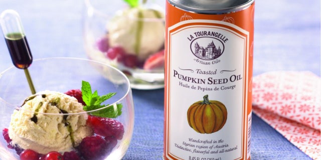 Toasted Pumpkin Seed Oil over ice cream topped with fruit.