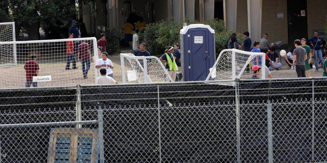 June 23, 2014: A temporary shelter for unaccompanied minors who have entered the country illegally is seen at Lackland Air Force Base in San Antonio, Texas.