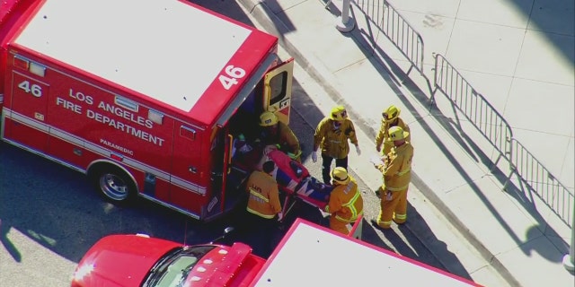 Nov. 21, 2016: Paramedics load an injured person into an ambulance after an accident in downtown Los Angeles