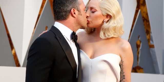 Presenter Lady Gaga arrives with boyfriend Taylor Kinney at the 88th Academy Awards in Hollywood, California February 28, 2016. REUTERS/Lucy Nicholson
TPX IMAGES OF THE DAY - RTS8FHG
