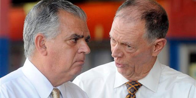 Transportation Secretary Ray LaHood, left, talks to FAA Administrator Randy Babbitt during a news conference to discuss the interruption of FAA funding in New York Aug. 1.