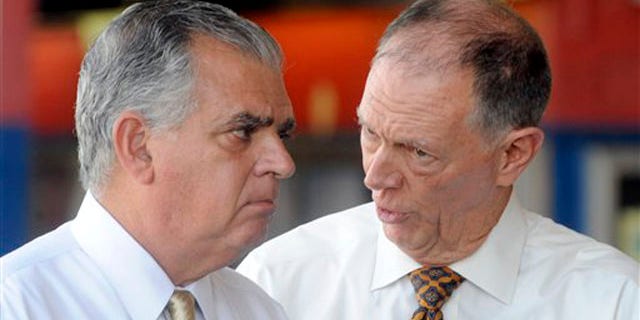 Transportation Secretary Ray LaHood, left, talks to FAA Administrator Randy Babbitt during a news conference to discuss the interruption of FAA funding in New York Aug. 1.