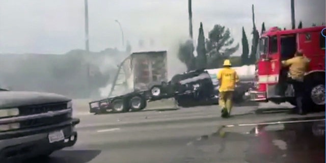 Firefighters respond to a deadly crash on Interstate 5 in Los Angeles Tuesday, April 25, 2017.