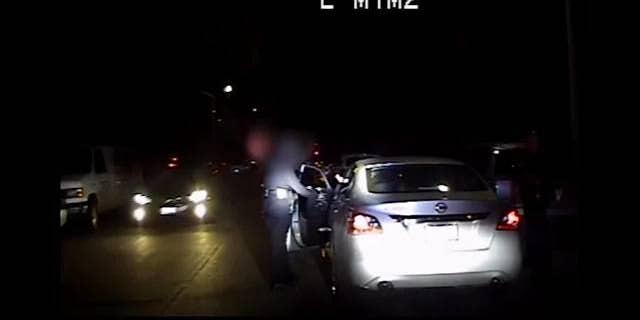 Authorities in California released dramatic footage that shows an LAPD officer being shot at point-blank range during a traffic stop.