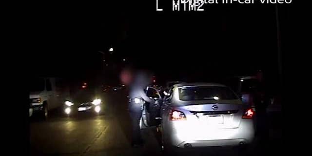 Authorities in California released dramatic footage that shows an LAPD officer being shot at point-blank range during a traffic stop.