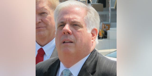 May 7, 2015: Maryland Gov. Larry Hogan, right, takes a question from a reporter.