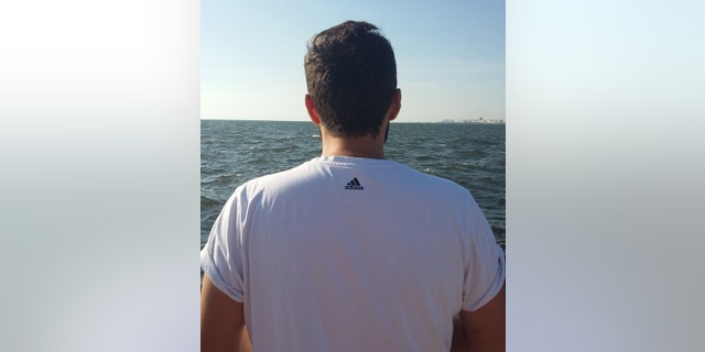 Fadi Salim is seen on his last day in Izmir, Turkey, looking out at the Aegean Sea.