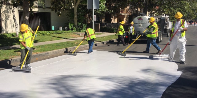 Officials in Los Angeles are painting streets white to reduce the effect of urban "heat islands."
