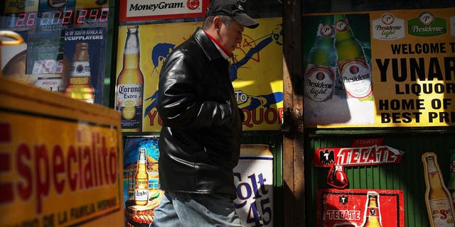 UNION CITY, NJ - MARCH 28: A man walks by adds in Spanish outside of a bodega on March 28, 2011 in Union City, New Jersey. Union City New Jersey, one of the stateÂs largest cities, has a population of Hispanic or Latino origin of over 80%. According to the new 2010 Census Bureau statistics reported last Thursday, the Hispanic population in the United States has grown by 43% in the last decade, surpassing 50 million and accounting for about 1 out of 6 Americans.  (Photo by Spencer Platt/Getty Images)