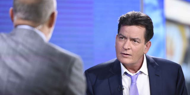 Former "Two and a Half Men" star Charlie Sheen, right, is interviewed by Matt Lauer, Tuesday, Nov. 17, 2015 on NBC's "Today" in New York. In the interview, the 50-year-old Sheen said he tested positive four years ago for the virus that causes AIDS. (Peter Kramer/NBC via AP)