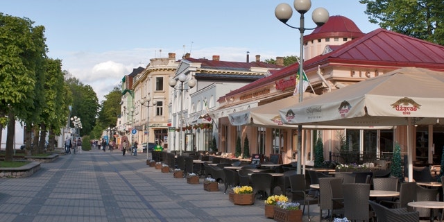 JURMALA, LATVIA - JUNE 2: Pedeastrians walk around Jomas Street at summer day on June 2, 2012 in Jurmala, Latvia. Jomas Street in Jurmala is one of the central and oldest streets of Jurmala with restaurants, summer terraces, hotels and cafes.