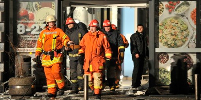 Nov. 21, 2013: Rescuers work at the Maxima grocery store after its roof collapsed in Riga, Latvia.