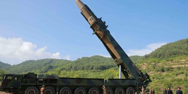 North Korean leader Kim Jong Un inspects the preparations for an intercontinental ballistic missile flight.