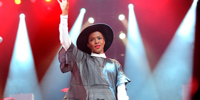 Feb. 5, 2014 file photo, singer Lauryn Hill performs at Amnesty International's "Bringing Human Rights Home" Concert at the Barclays Center in New York.