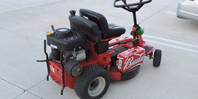 Police arrested a man in Florida after he drove down U.S. Highway 1 on a lawn mower, holding a case of beer.