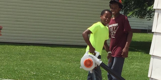 Reggie Fields' lawn mowing service is booming after a neighbor called the police on him.