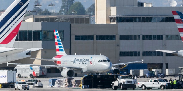 An airport utility truck is seen overturned after an Aeromexico flight clipped the truck, flipping it over, shortly after landing at Los Angeles International Airport Saturday, May 20, 2017.