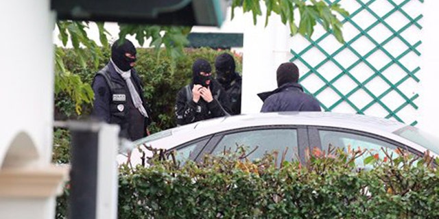 French police officers outside a villa during a search operation in Ascain, south western France, Saturday, Nov. 5, 2016. French police arrested the leader of the debilitated Basque militant group ETA, Spain's Interior Ministry said Saturday. Spanish authorities identified Mikel Irastorza as "currently the maximum leader" of ETA. (AP Photo)