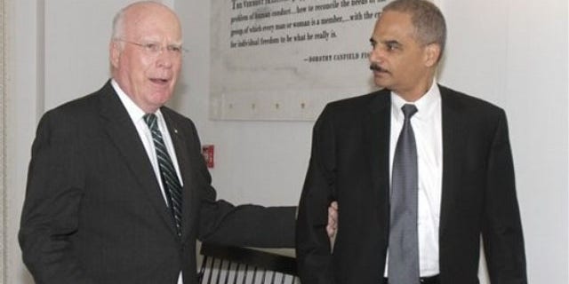 Attorney General Eric Holder, right, is shown with Sen. Patrick Leahy in Montpelier, Vt., Sept. 10. (AP Photo)