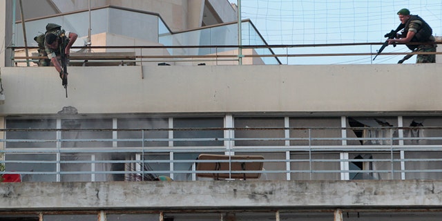 May 24, 2012: Lebanese army soldiers, fire their weapons on the apartment balcony of a Syrian gunman who had engaged in an hours-long shootout with the security forces, in Beirut, Lebanon.