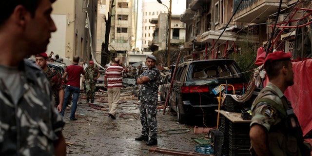Oct. 19, 2012: Lebanese security forces gather at the site of a car bomb attack in the in the mostly Christian neighborhood of Achrafiyeh, Beirut, Lebanon.