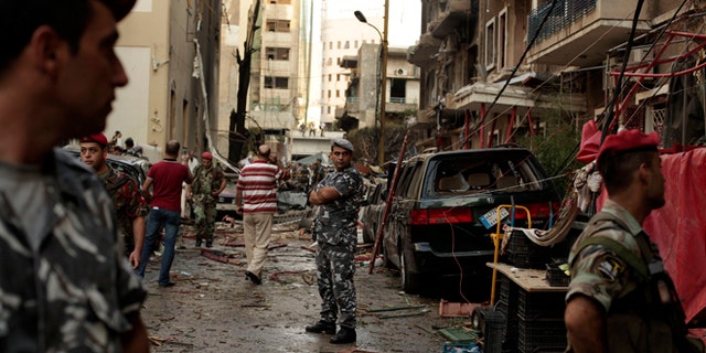 Oct. 19, 2012: Lebanese security forces gather at the site of a car bomb attack in the in the mostly Christian neighborhood of Achrafiyeh, Beirut, Lebanon.