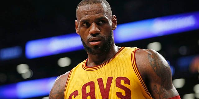 Cleveland Cavaliers forward LeBron James (23) stares down an opponent in the second half of an NBA basketball game, Thursday, March 24, 2016, in New York. The Nets upset the Cavaliers 104-95. (AP Photo/Kathy Willens)