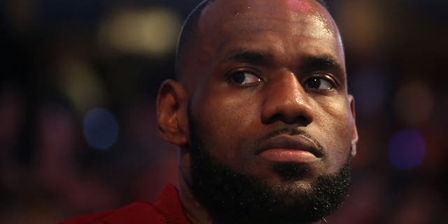 CLEVELAND, OH - JUNE 7: LeBron James #23 of the Cleveland Cavaliers during the national anthem before the game against the Golden State Warriors in Game Three of the 2017 NBA Finals on June 7, 2017 at Quicken Loans Arena in Cleveland, Ohio. NOTE TO USER: User expressly acknowledges and agrees that, by downloading and or using this photograph, user is consenting to the terms and conditions of Getty Images License Agreement. Mandatory Copyright Notice: Copyright 2017 NBAE (Photo by Nathaniel S. Butler/NBAE via Getty Images)