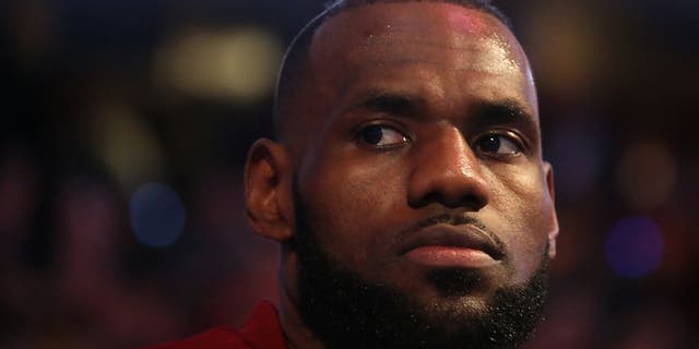 CLEVELAND, OH - JUNE 7: LeBron James #23 of the Cleveland Cavaliers during the national anthem before the game against the Golden State Warriors in Game Three of the 2017 NBA Finals on June 7, 2017 at Quicken Loans Arena in Cleveland, Ohio. NOTE TO USER: User expressly acknowledges and agrees that, by downloading and or using this photograph, user is consenting to the terms and conditions of Getty Images License Agreement. Mandatory Copyright Notice: Copyright 2017 NBAE (Photo by Nathaniel S. Butler/NBAE via Getty Images)