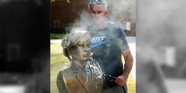 Retired Col. Lee Busby is entering the Alabama Senate race with a long-shot bid against embattled Republican Roy Moore. He is also an artist who sculpts Alabamian troops who have been killed in Iraq or Afghanistan. (Gary Cosby Jr./The Tuscaloosa News via AP)