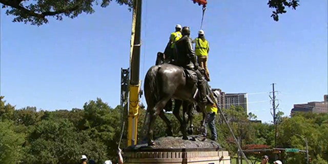Workers were preparing to remove the statue before a judge's order stopped them.