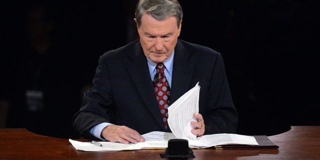 Oct. 3, 2012: Moderator Jim Lehrer looks over his notes before the first presidential debate.