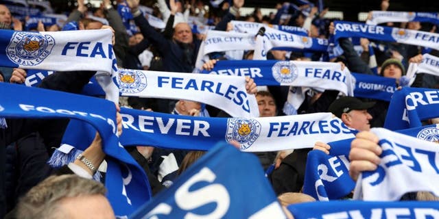 LONDON, ENGLAND - MARCH 19: Leicester City fans celebrate going 8 points clear at the top of the Premier League after the Premier League match between Crystal Palace and Leicester City at Selhurst Park on March 19, 2016 in London, United Kingdom. (Photo by Plumb Images/Leicester City FC via Getty Images)