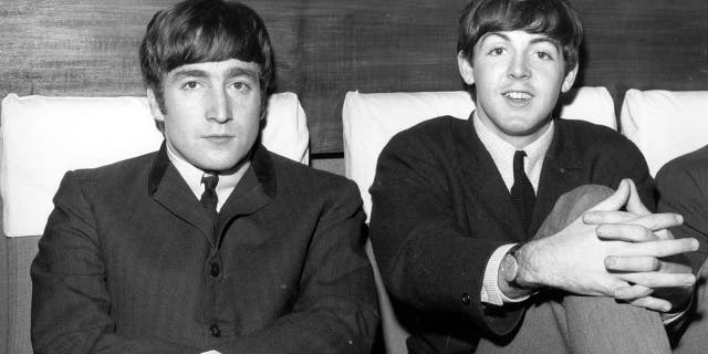 John Lennon (1940 - 1980), singer and guitarist, left, and Paul McCartney, singer and bass guitarist, circa 1963.