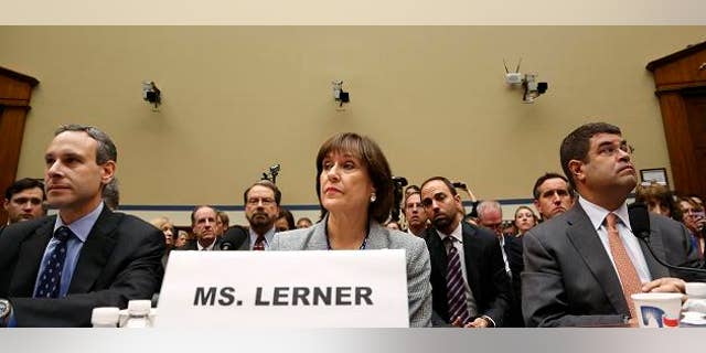 Former U.S. Internal Revenue Service Commissioner Douglas Shulman (L-R), IRS Director of Exempt Organizations Lois Lerner and U.S. Deputy Treasury Secretary Neal Wolin take their seats to testify before a House Oversight and Government Reform Committee hearing on targeting of political groups seeking tax-exempt status from by the IRS, on Capitol Hill in Washington, May 22, 2013. REUTERS/Jonathan Ernst (UNITED STATES - Tags: POLITICS BUSINESS) - RTXZWRA