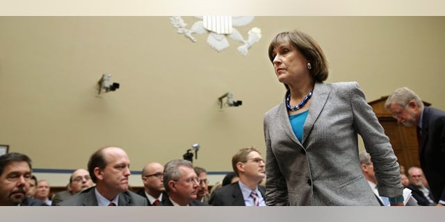 WASHINGTON, DC - MAY 22: Internal Revenue Service Director of Exempt Organizations Lois Lerner leaves a hearing of the House Oversight and Government Reform Committee after refusing to testify May 22, 2013 in Washington, DC. The committee is investigating allegations that the IRS targeted conservative non-profit organizations with the words "tea party" and "constitution" in their names for additional scrutiny. Lerner, who headed the division that oversees exempt organizations, exercised her constitutional right not to answer questions. (Photo by Chip Somodevilla/Getty Images)