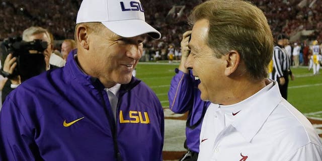 TUSCALOOSA, AL - NOVEMBER 09: (L-R) Head coach Les Miles of the LSU Tigers talks with head coach Nick Saban of the Alabama Crimson Tide before the game at Bryant-Denny Stadium on November 9, 2013 in Tuscaloosa, Alabama. (Photo by Kevin C. Cox/Getty Images)