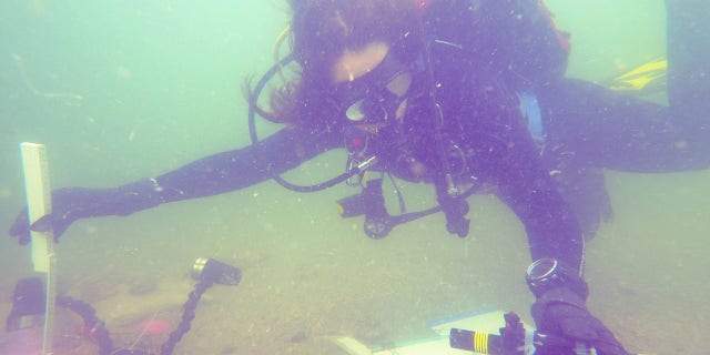 FPAN partner, Nicole Grinnan, measures the test unit’s depth using a laser level and folding ruler.