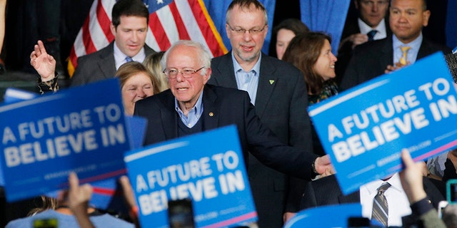 Levi Sanders stands behind his father Sen. Bernie Sanders, I-Vt., in 2016 during his Democratic primary presidential run.