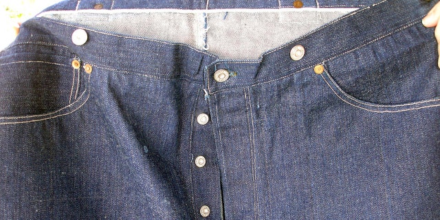 This undated photo provided by Daniel Buck Auctions, of Lisbon Falls, Maine, shows a portion of a pair of 125-year-old Levi Strauss & Co., denim blue jeans that sold for nearly $100,000 this month. The buyer was from Asia.