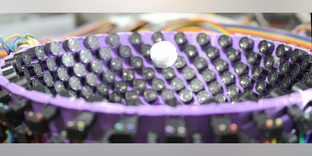 A styrofoam particle, 0.6 inches (1.6 cm) in diameter, levitates in the center of an ultrasonic generator of virtual vortices.