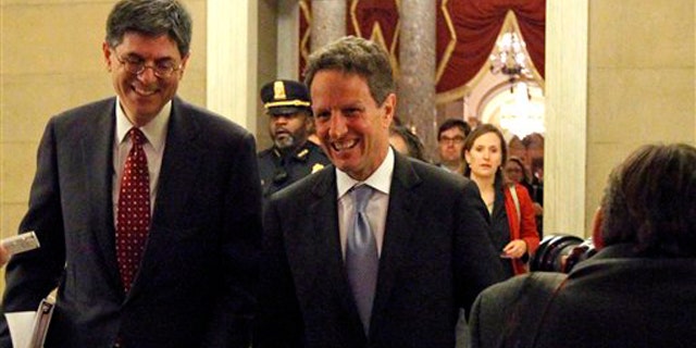 Treasury Secretary Timothy Geithner, center, with White House budget director Jacob Lew, arrive at the speaker's office for a meeting about tax cuts on Capitol Hill Dec. 1. (AP Photo)
