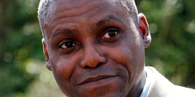 In this April 11, 2011 file photograph, former Olympic gold medalist Carl Lewis announces in Mount Holly, N.J., his candidacy for the New Jersey state Senate seat to represent his hometown of Willlingboro.