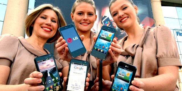 Models show off LG's new 3D phone at the Mobile World Congress 2011 show in Barcelona.
