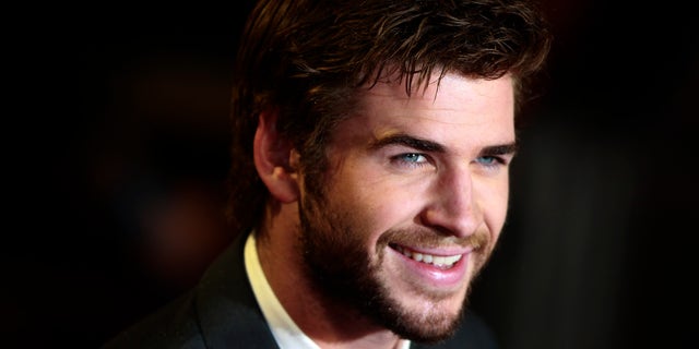 Actor Liam Hemsworth arrives for the world premiere of "The Hunger Games : Catching Fire" at Leicester Square in London November 11, 2013. REUTERS/Luke MacGregor (BRITAIN - Tags: ENTERTAINMENT SOCIETY) - RTX159PF