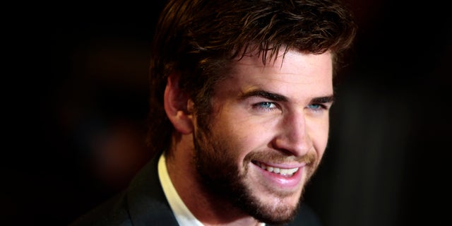 Actor Liam Hemsworth arrives for the world premiere of "The Hunger Games : Catching Fire" at Leicester Square in London November 11, 2013. REUTERS/Luke MacGregor (BRITAIN - Tags: ENTERTAINMENT SOCIETY) - RTX159PF