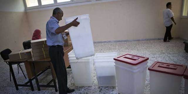 July 6, 2012: A Libyan election official works at a polling station in Tripoli, Libya. The Libyan National Assembly elections - the first free election since 1969-will take place on July 7, 2012.
