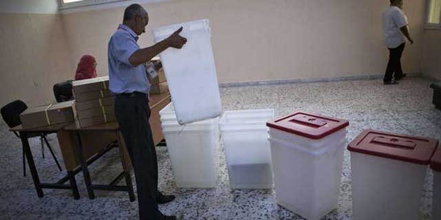 July 6, 2012: A Libyan election official works at a polling station in Tripoli, Libya. The Libyan National Assembly elections - the first free election since 1969-will take place on July 7, 2012.